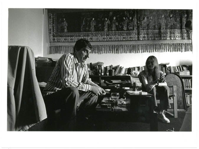 Item #39374 An original b/w photograph by Harold Chapman of Alexander Trocchi and Sally Child, taken in Trocchi's flat in Observatory Gardens, Holland Park, c. late-1970s.