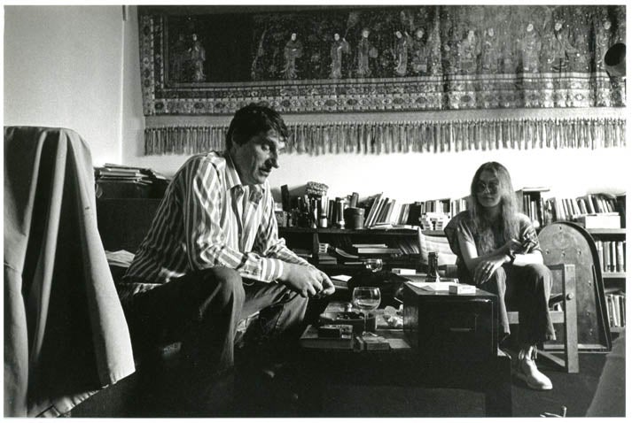 Item #39375 An original b/w photograph by Harold Chapman of Alexander Trocchi and Sally Child, taken in Trocchi's flat in Observatory Gardens, Holland Park, c. late-1970s.