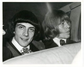 Two original 8x10 press photographs together with two exceedingly rare stickers relating to Brian Jones's arrest for drug possession in May 1967.