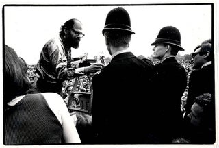 Item #39620 An original b/w photograph by Malcolm Hart capturing the moment Allen Ginsberg handed...