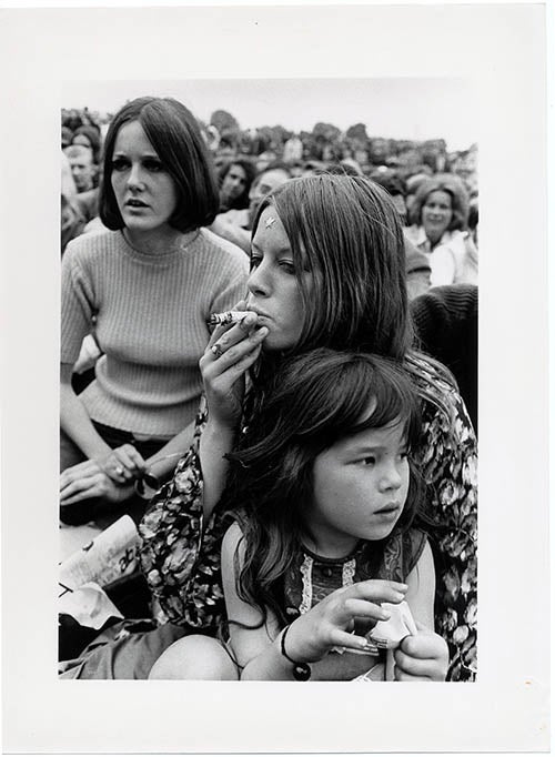 Item #39622 An original large size b/w photograph by Harold Chapman of a woman smoking a joint at the second Legalise Pot Rally in Hyde Park, London, July 7, 1968. 1968 LEGALISE POT RALLY.