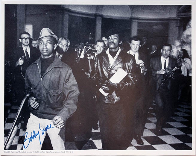 Item #39818 Li’L Bobby Hutton and Bobby Seale storming the California State Capitol at Sacramento, May 2, 1967. BLACK PANTHER PARTY.