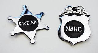 Youth International Party Communiqué #1 with two Yippie badges, ‘Freak’ and ‘Narc’, as issued.