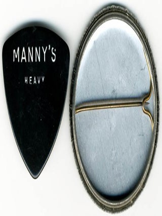 An original badge and a Manny’s bass guitar pick, issued to promote Patti Smith’s song, “Rock n’ Roll Nigger”, a track from her album “Easter” (1978).