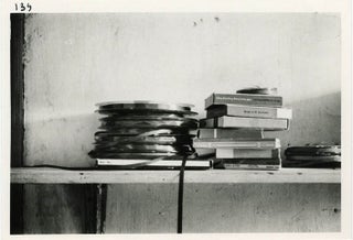 Item #40803 A b/w photograph by Harold Chapman of a collection of open reel tapes and tape boxes...