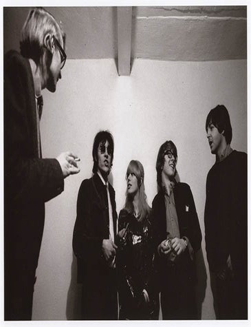 Item #41237 A publicity b/w photograph by Graham Keen of Barry Miles, John Dunbar, Marianne Faithfull, Peter Asher and Paul McCartney in the basement of Indica, 6 Mason&rsquo;s Yard, c. January 1966. INDICA BOOKS, GALLERY.