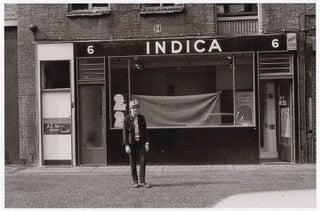 Item #41260 A b/w photograph by Keith Avison of Peter Asher standing outside Indica, taken...