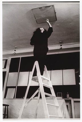 Item #41289 A b/w photograph by Graham Keen of Yoko Ono at Indica, standing on the top step of a...
