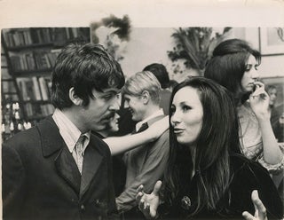Item #41302 An original b/w press photograph of Paul McCartney and Julie Felix at a party in...